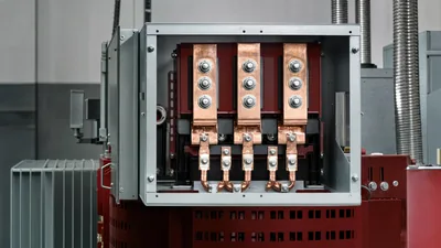 Industrial transformer wiring terminal compartment showing primary and secondary busbar hook ups
