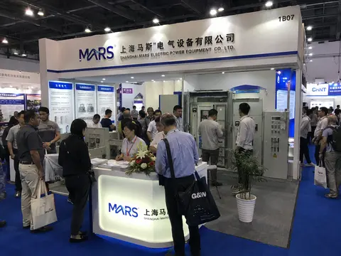 Crowded MARS exhibition booth with product displays and signage